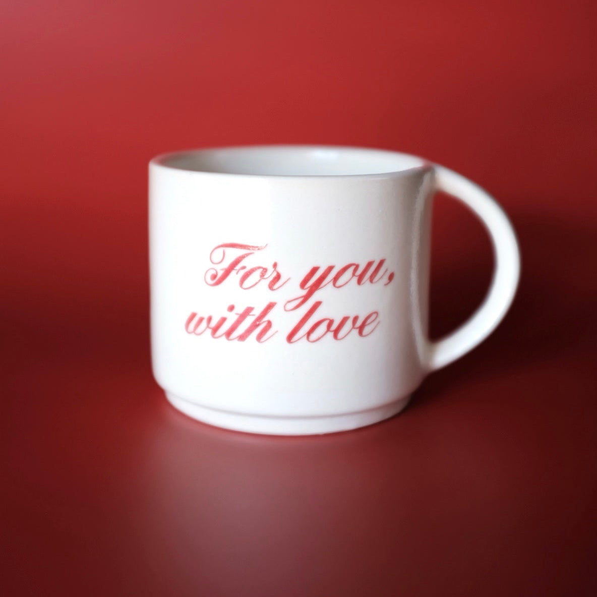 White mug with 'For you, with love' text on a red 