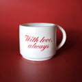 White  cappuccino cup with red text 'With love, always' on a red background