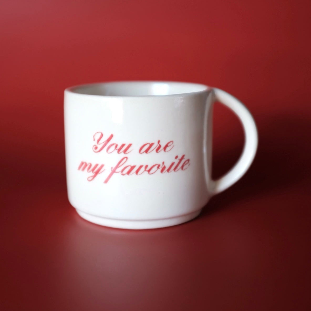 White mug with 'You are my favorite' text on a red 