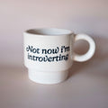 White mug with 'Not now i'm introverting' text 